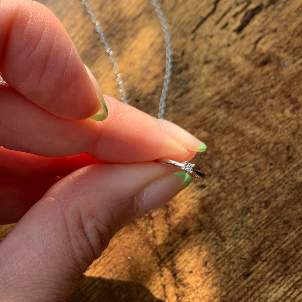 Necklace with small diamond and ring pendant